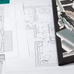 building blueprints on an architect table 2021 08 26 15 25 31 utc