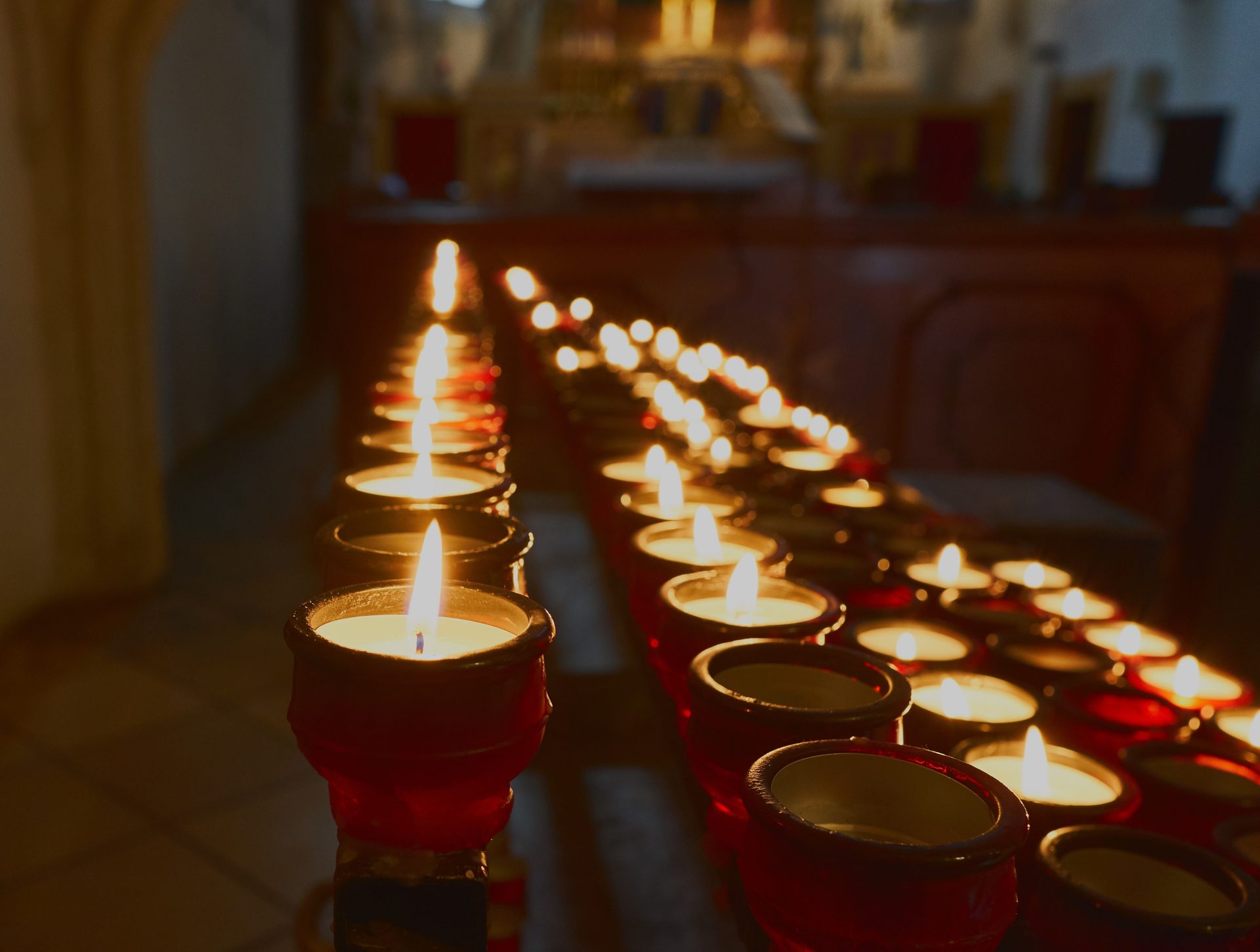 burning candles in the church 2022 11 16 17 58 11 utc