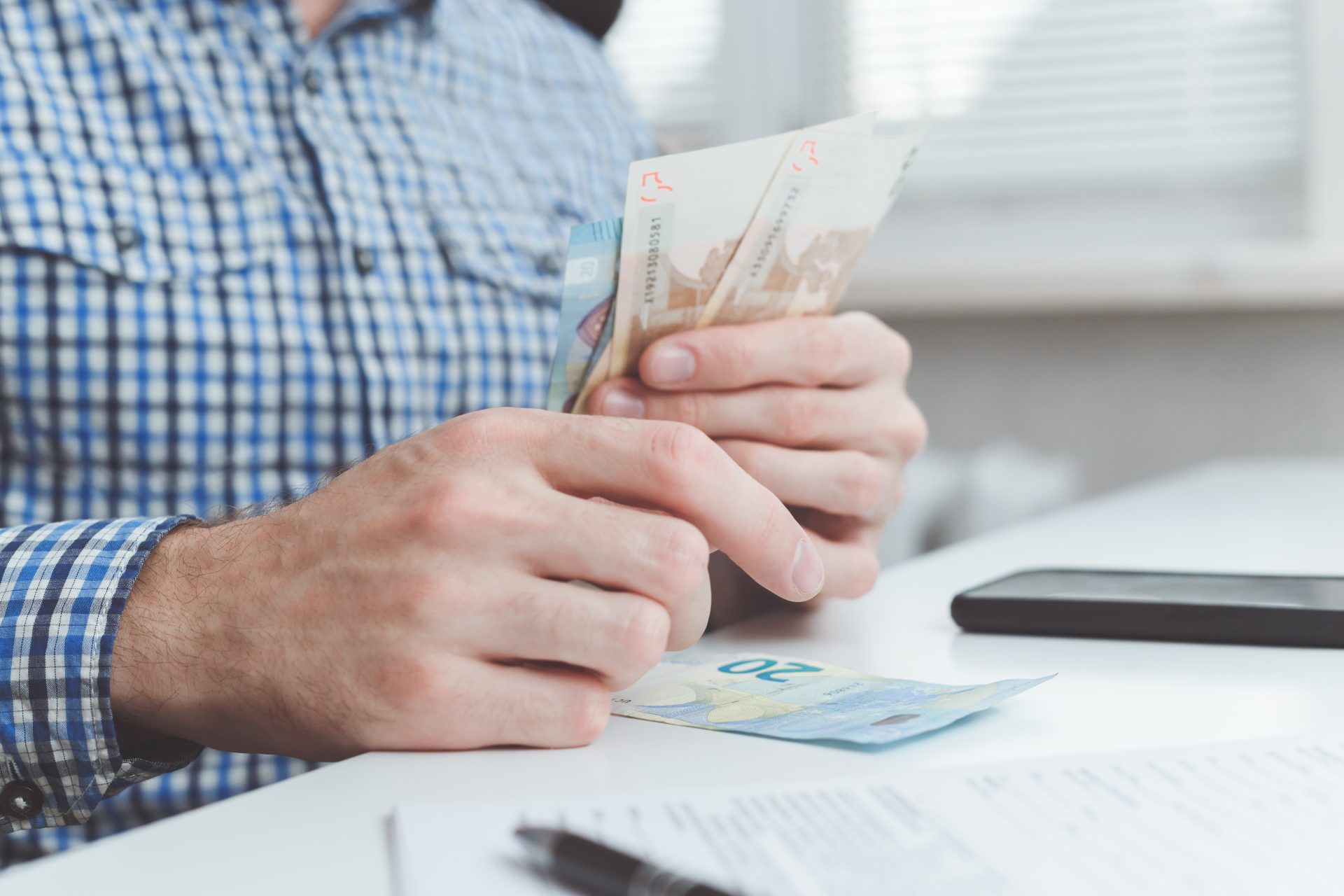 businessman calculates the costs incurred or salar 2022 12 16 21 44 37 utc