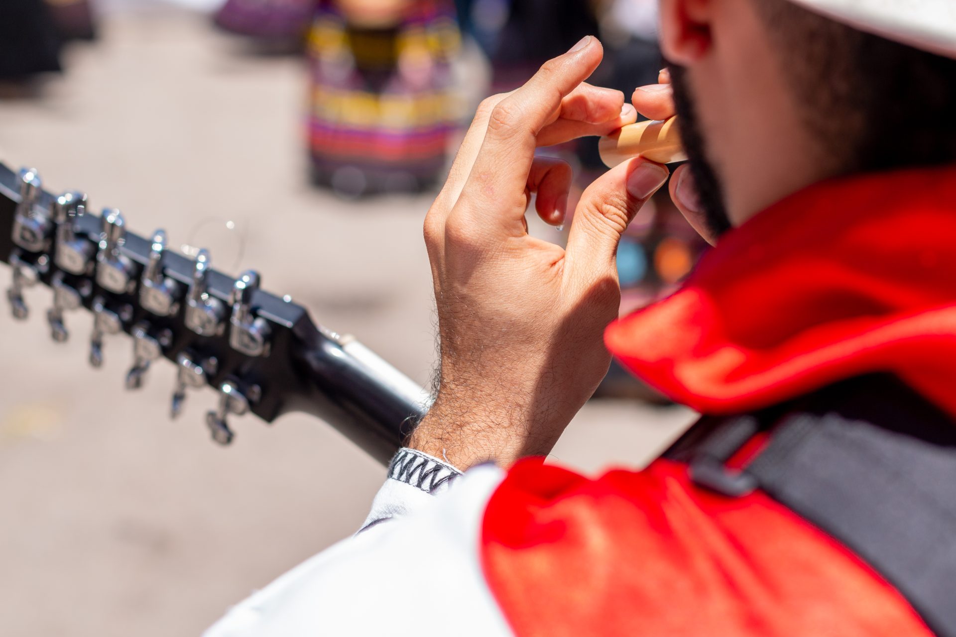 close up of a man playing a bamboo flute outdoors 2022 08 18 19 21 24 utc