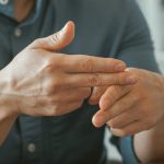 close up of businessman using sign language while 2023 05 05 03 08 46 utc