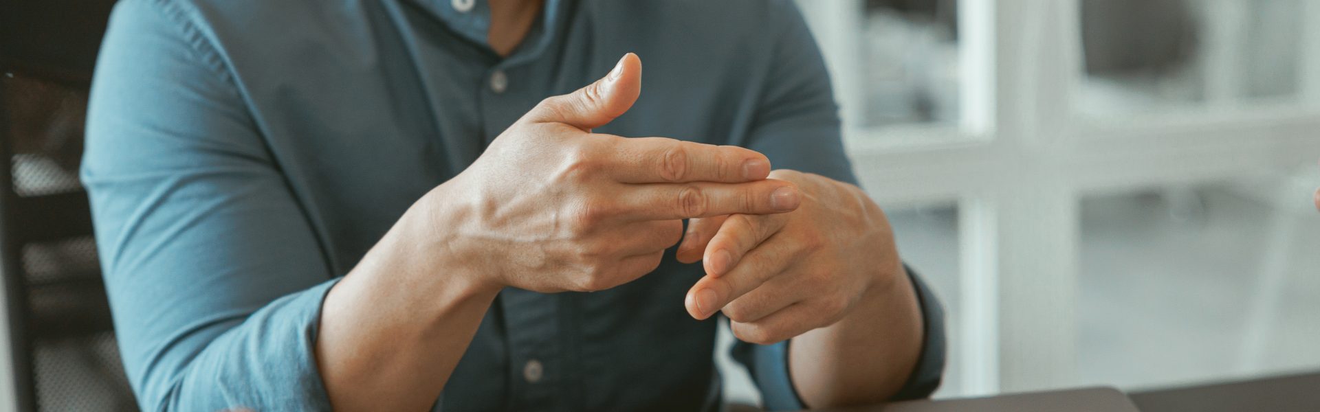 close up of businessman using sign language while 2023 05 05 03 08 46 utc