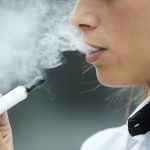 closeup of woman smoking electronic cigarette outd 2021 08 26 15 46 09 utc
