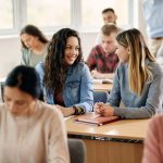 happy female students talking during a class at un 2023 02 02 18 54 47 utc