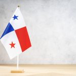 panama table flag on white textured wall 2022 12 16 11 17 08 utc