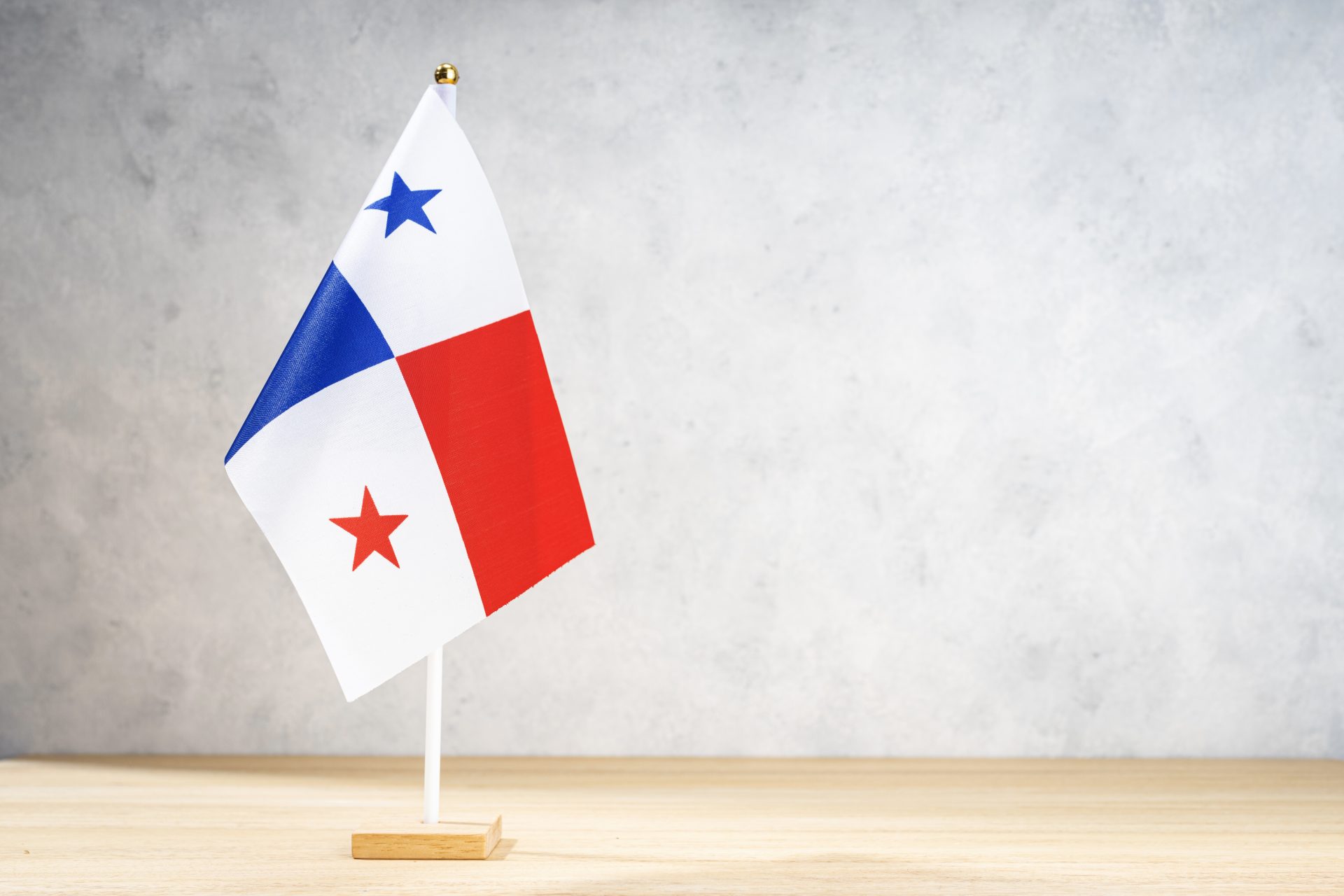 panama table flag on white textured wall 2022 12 16 11 17 08 utc