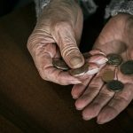 pensioner counting money into her hands 2022 04 19 01 33 34 utc