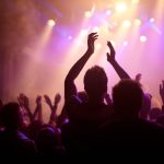 rock on rear view of a music fan dancing with her 2023 01 04 20 11 49 utc