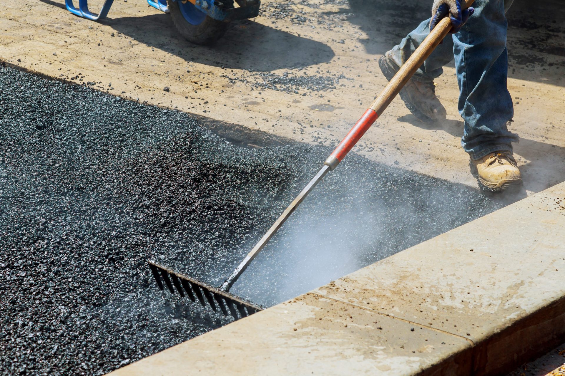 workers on asphalting paver during road street rep 2022 11 12 10 36 06 utc