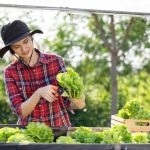 young female farmer happily collects organically g 2023 03 30 20 07 15 utc