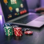 young man play online poker in laptop 2022 07 12 14 36 13 utc 1