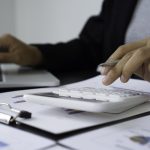 an asian female finance worker typing one hand on 2023 11 27 05 00 58 utc