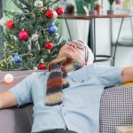asia man hangover and passed out sleep on sofa aft 2023 11 27 05 27 49 utc