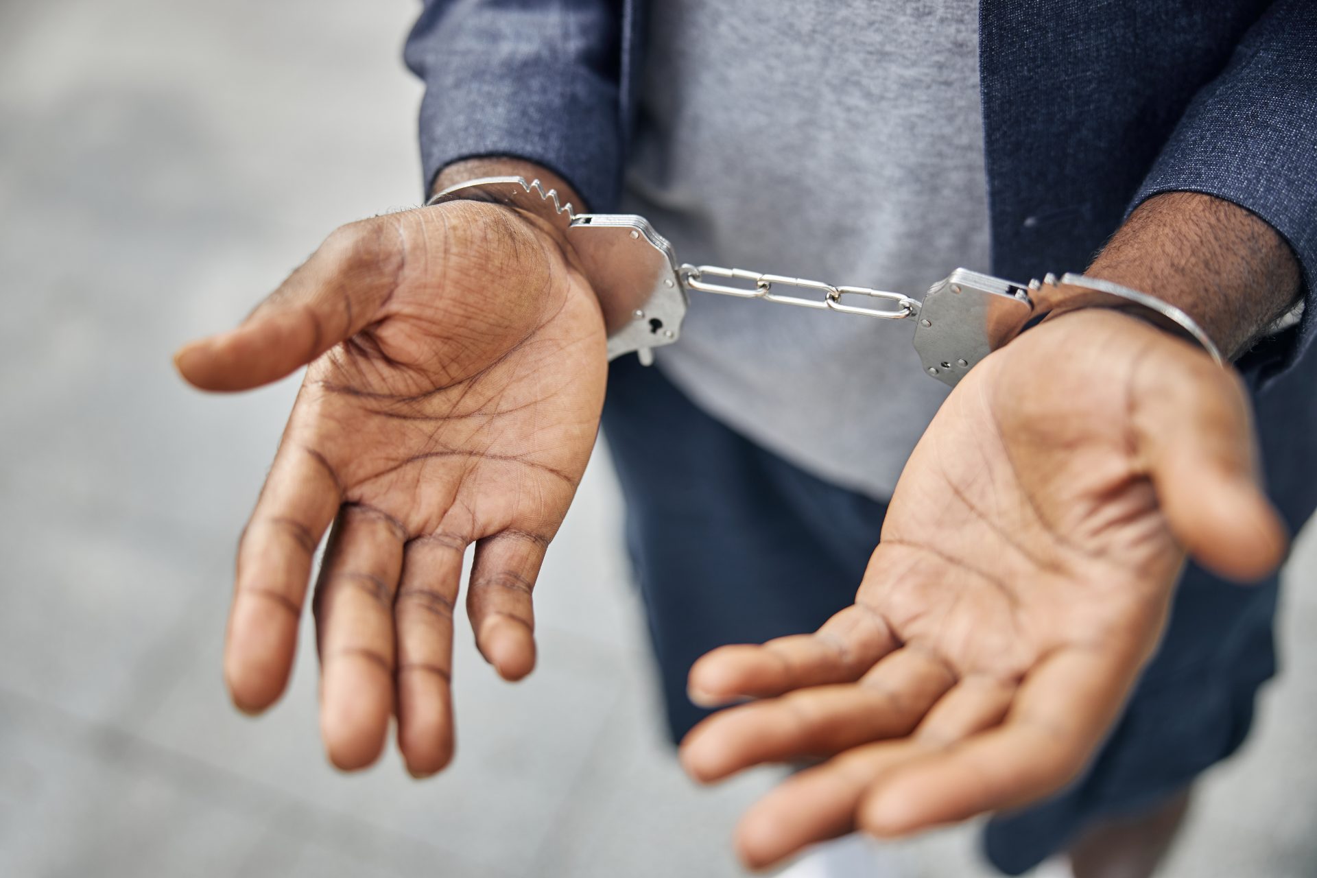 focused photo on male hands being in handcuffs 2023 11 27 05 07 30 utc