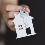 hand holding the key and home shaped keychain mor 2023 11 27 05 29 05 utc