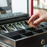 latina girl taking money out of the cash register 2023 11 27 05 36 21 utc
