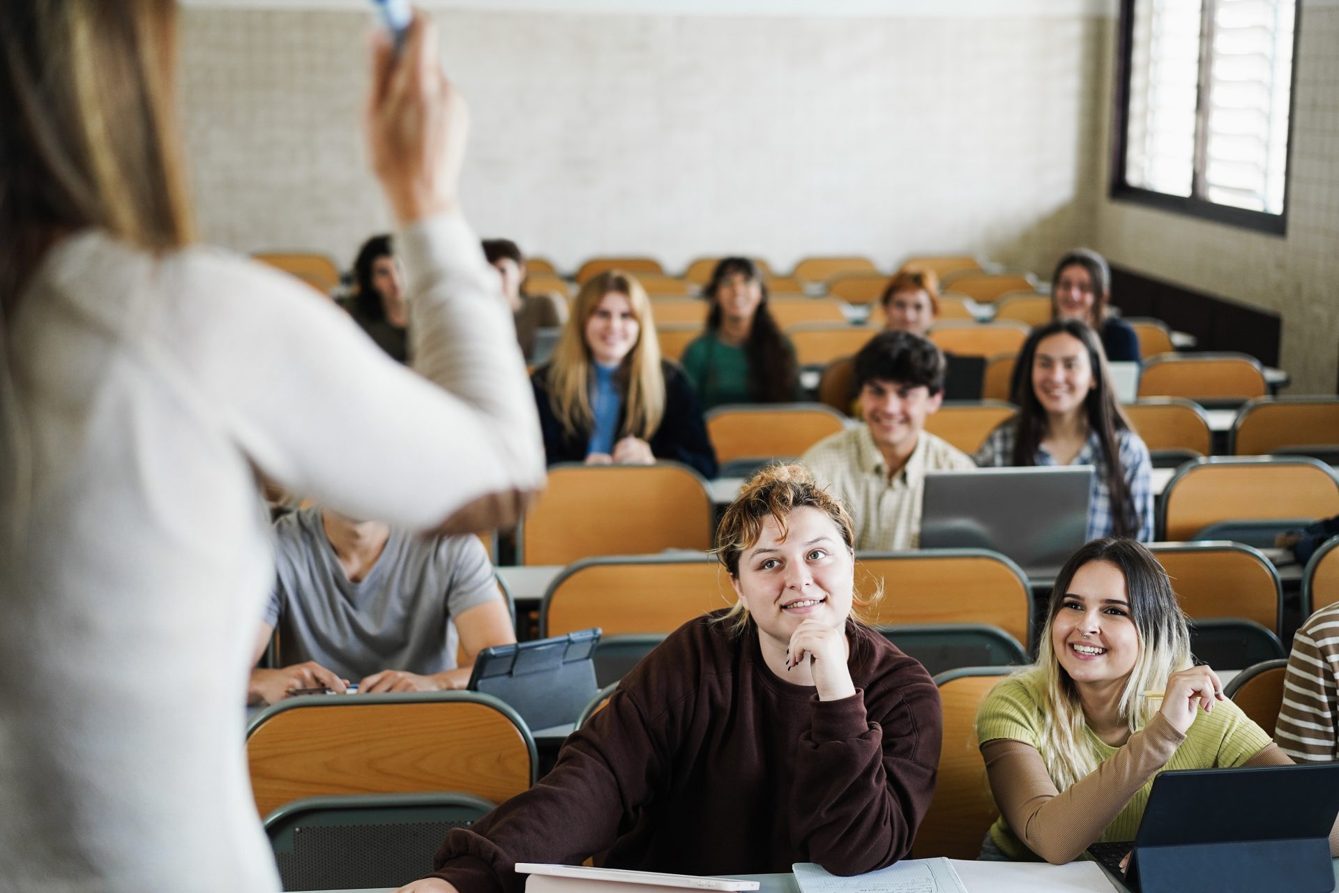mature teacher working with students inside classr 2023 11 27 05 24 17 utc