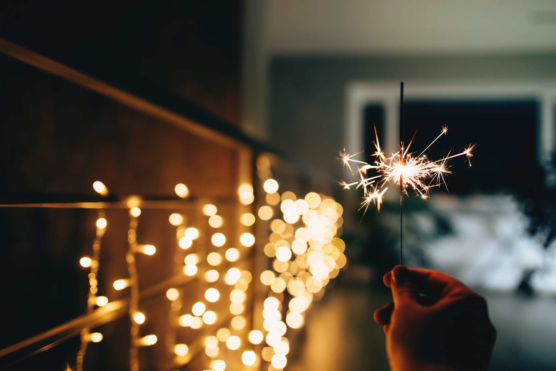 sparklers on blurred christmas lights festive moo 2023 11 27 05 15 57 utc