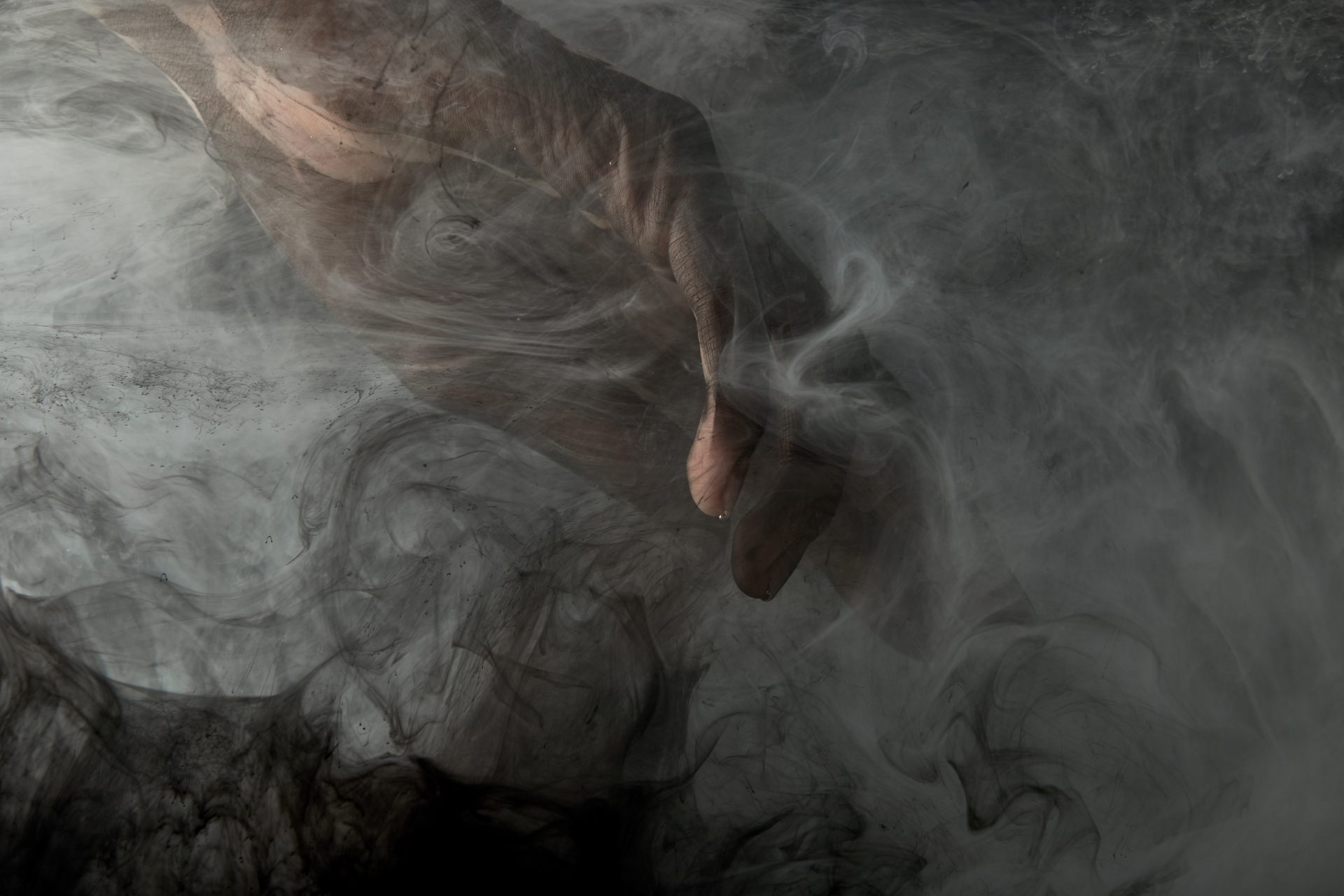 partial view of male hand in grey smoke 2023 11 27 05 22 50 utc