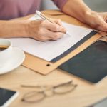 busy female person making notes during work 2023 11 27 05 12 32 utc