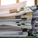 close up of business documents stack on desk rep 2023 11 27 05 07 09 utc