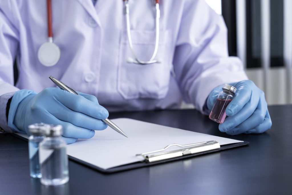 doctors in blue gloves with new vaccine for corona 2023 11 27 05 08 04 utc
