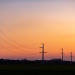 high voltage power tower over sunset clear sky bl 2023 11 27 05 07 24 utc