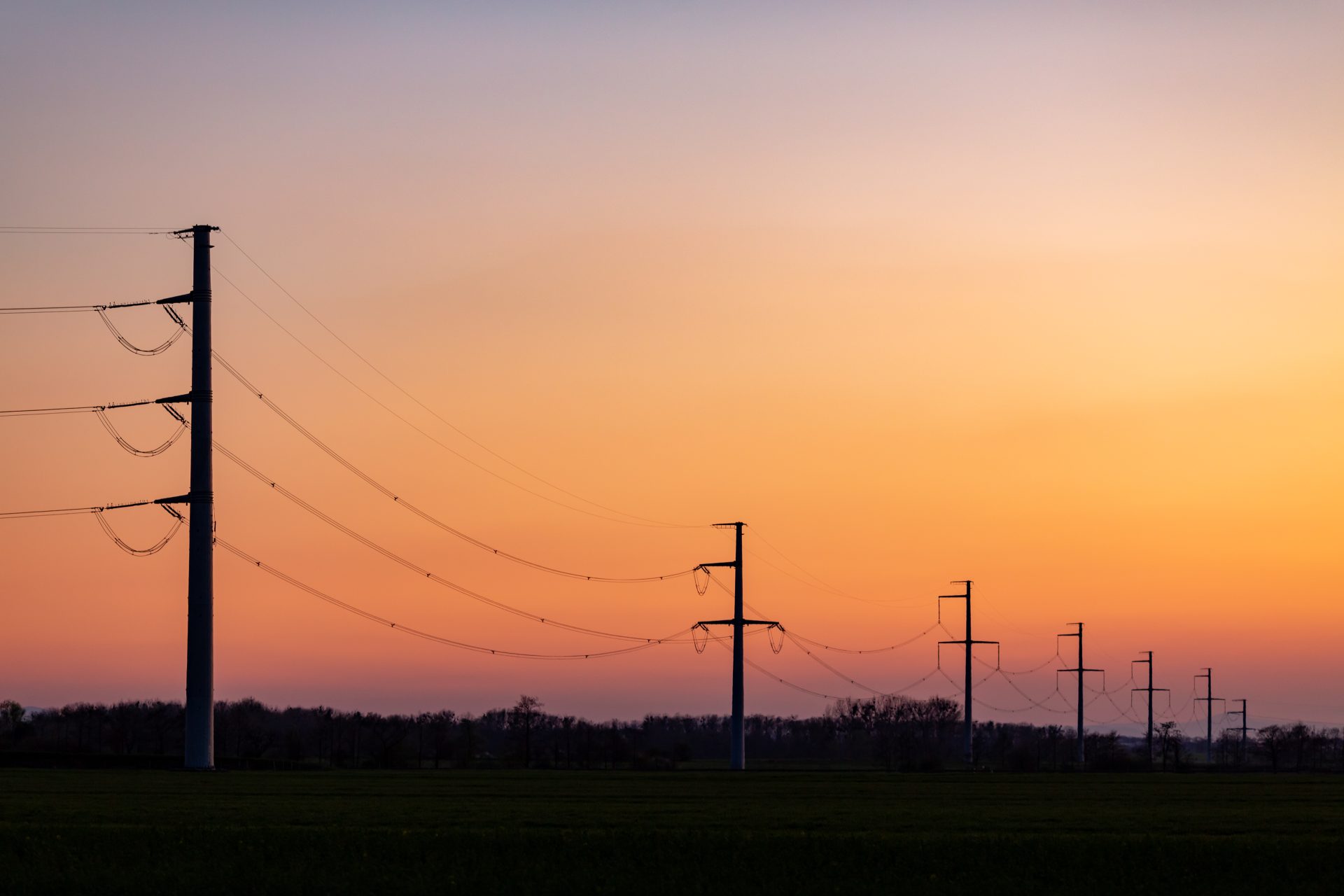 high voltage power tower over sunset clear sky bl 2023 11 27 05 07 24 utc