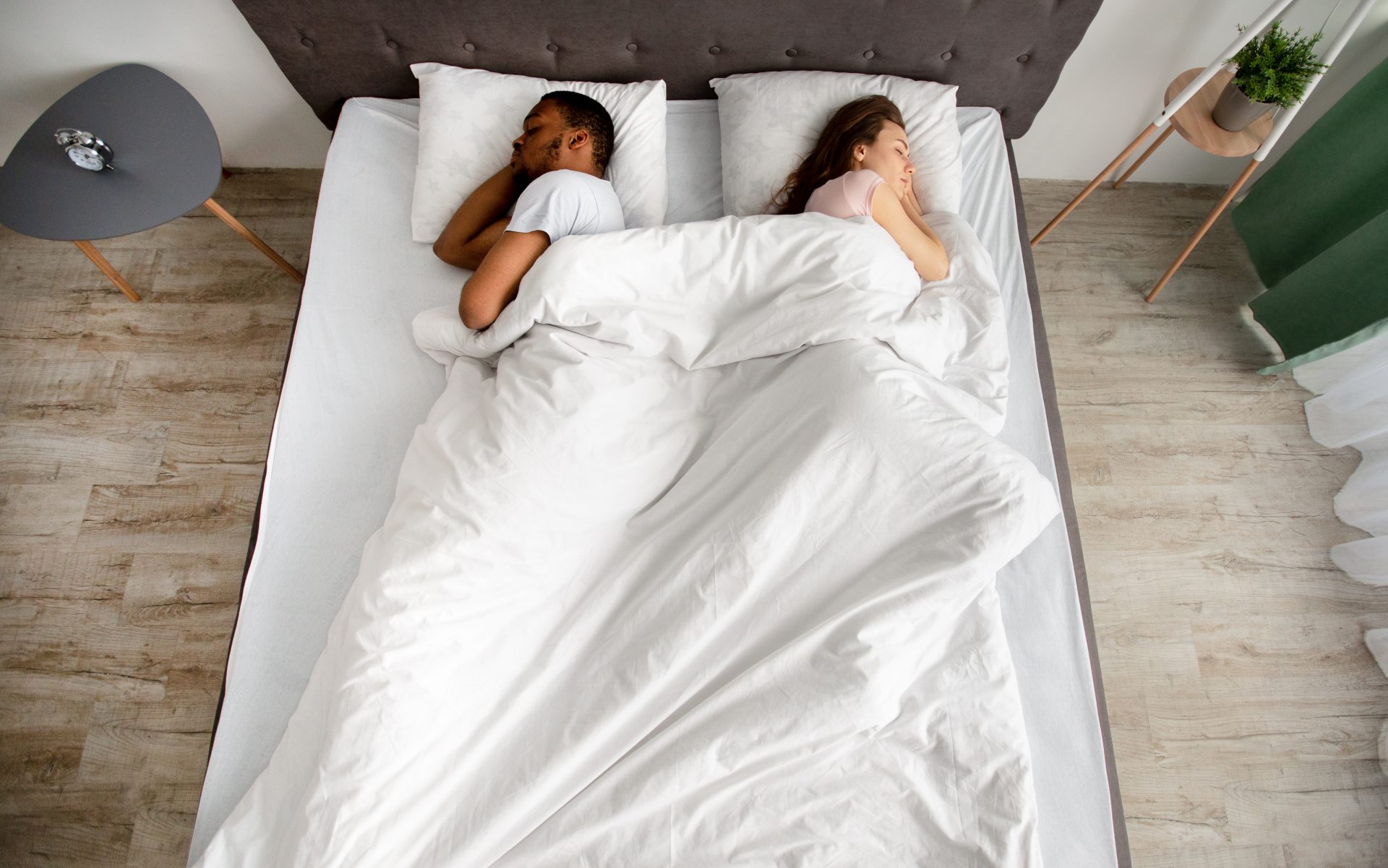 top view of young interracial couple sleeping back 2023 11 27 05 25 51 utc