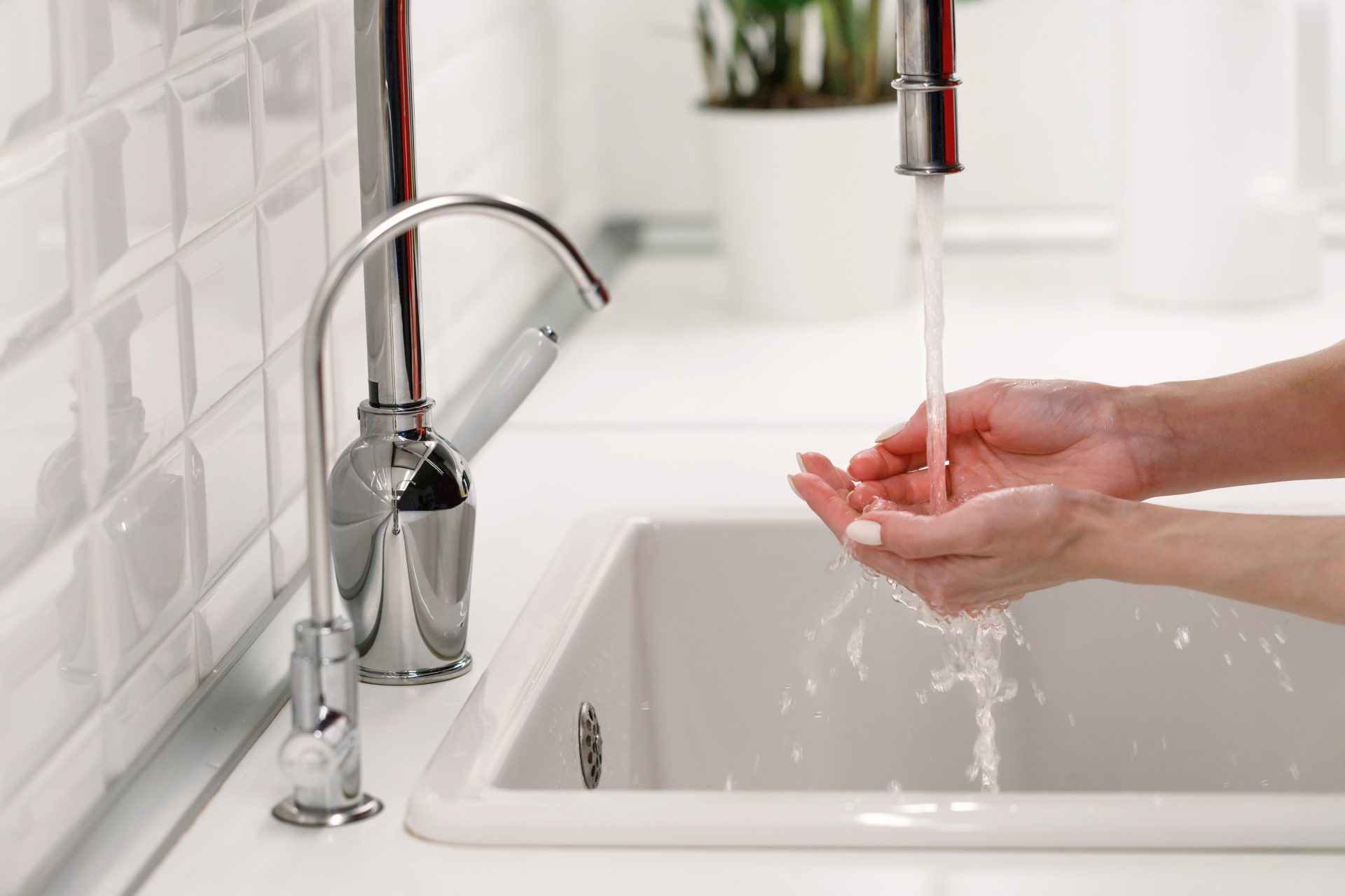 woman washing and cleaning her hands under flowing 2023 11 27 05 10 48 utc