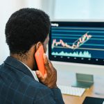 black male trader talking on smartphone 2023 11 27 05 15 56 utc