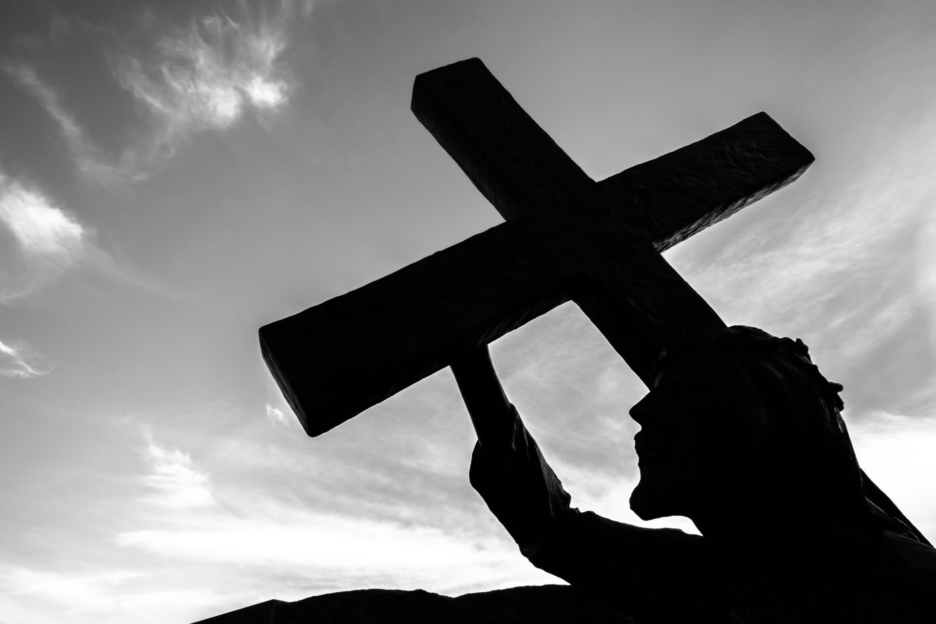 bronze statue of jesus carrying his cross on the 2023 11 27 05 07 44 utc
