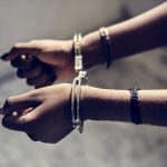 closeup of arrested hands with handcuffs 2023 11 27 05 13 57 utc