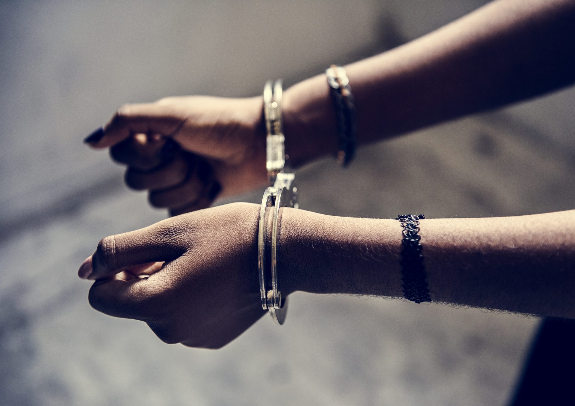 closeup of arrested hands with handcuffs 2023 11 27 05 13 57 utc