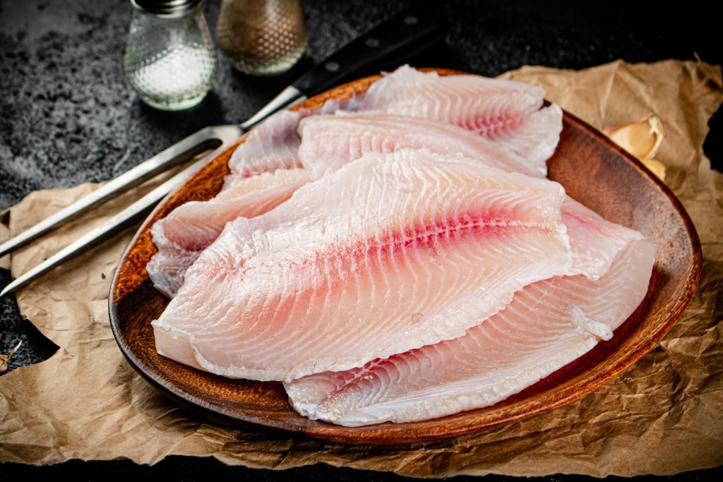 fresh fish fillet on a wooden plate 2023 11 27 04 57 18 utc