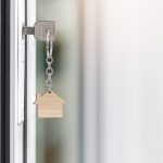 key with house shape keychain in the door keyhole 2023 11 27 05