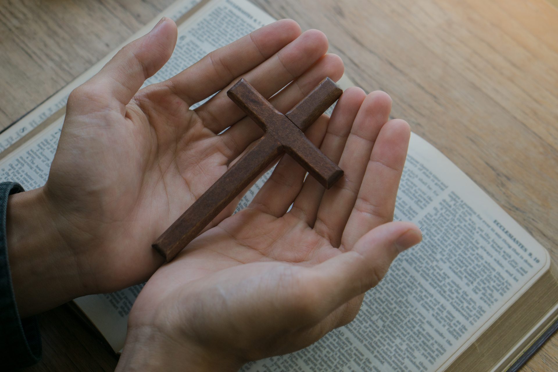 christian man holding jesus cross hands folded in 2023 11 27 04 59 56 utc