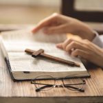 close up of hands on the bible bible study praye 2023 11 27 05 07 15 utc