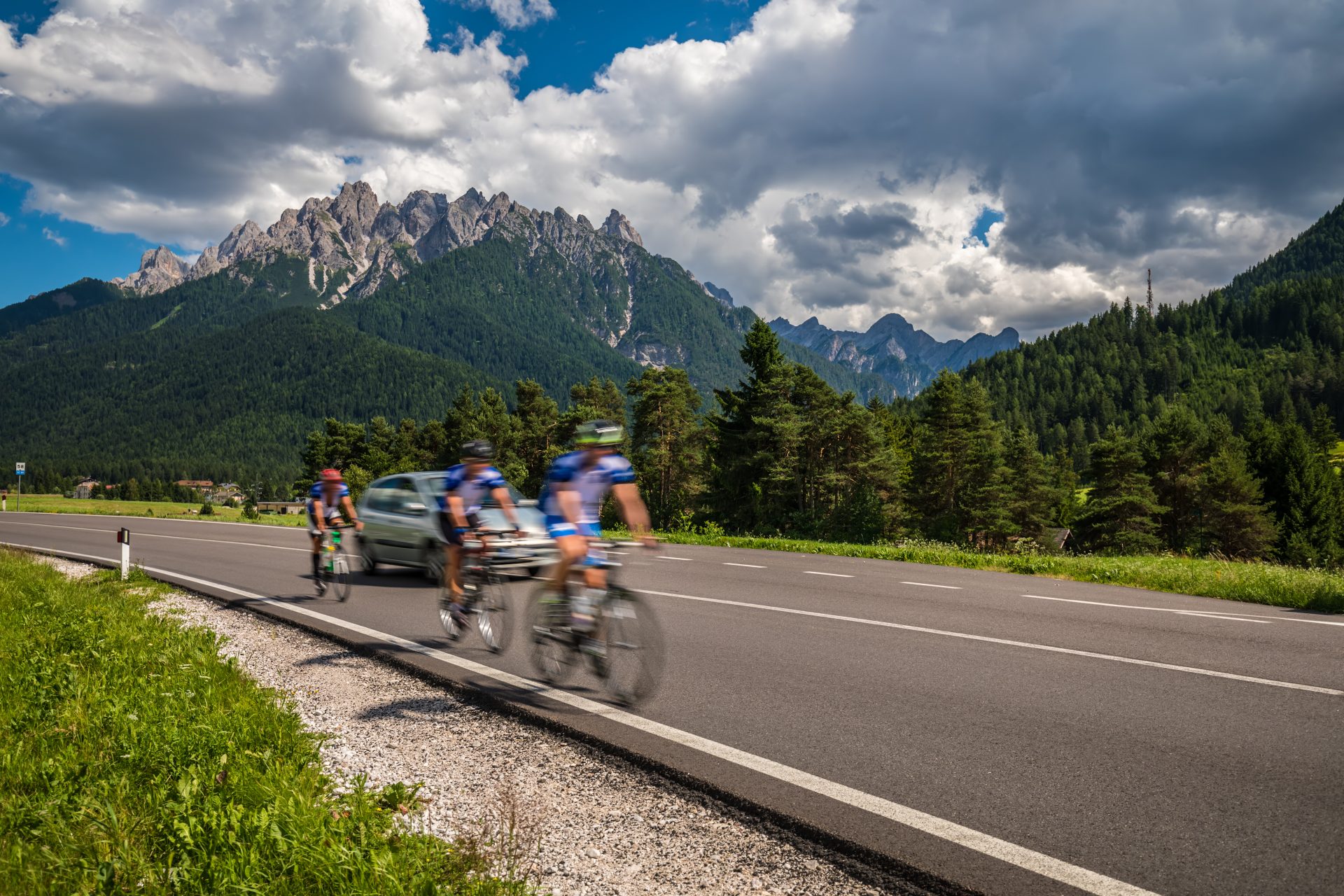 cyclists riding a bicycle on the road in the backg 2023 11 27 05 00 24 utc