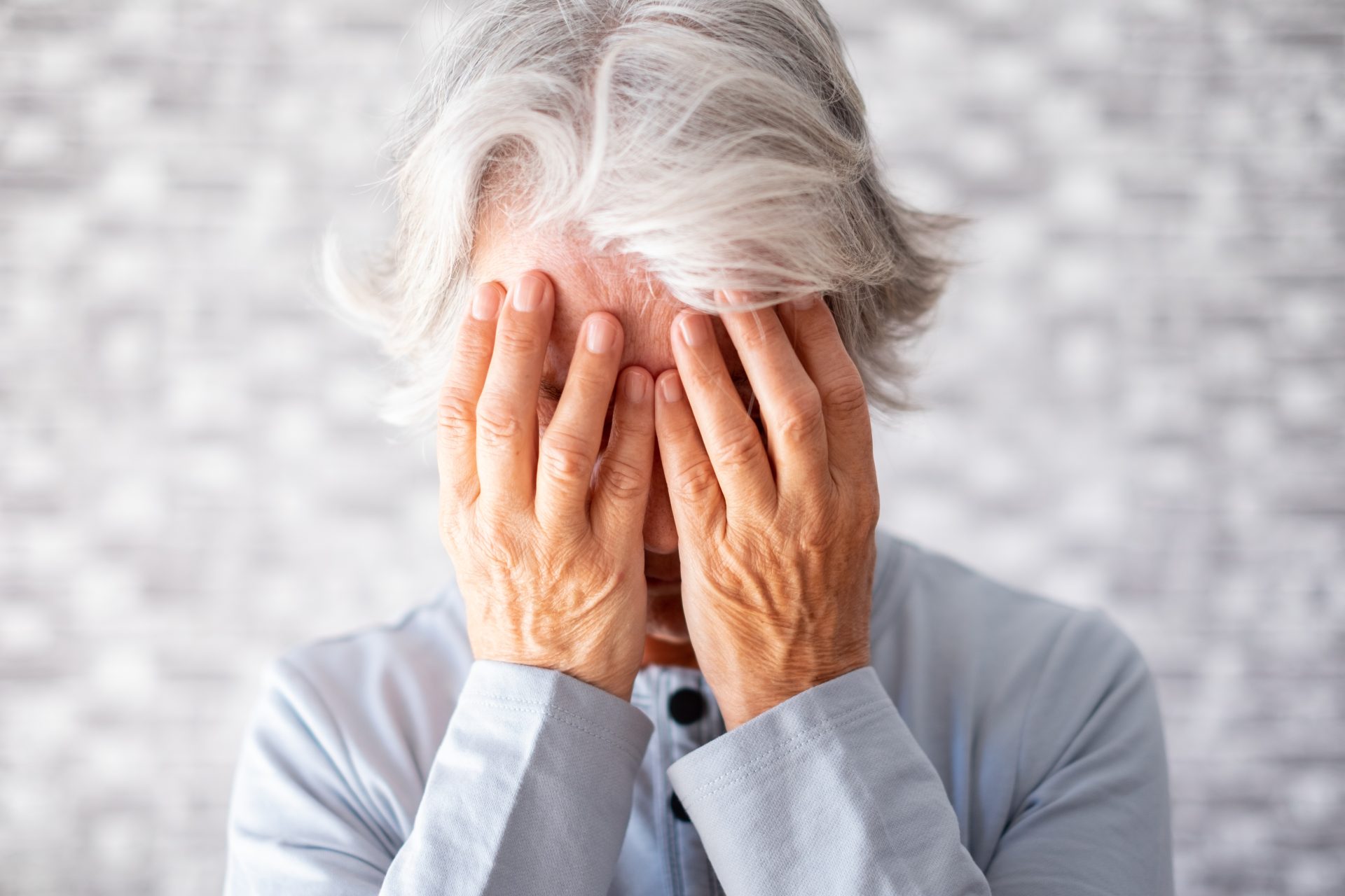 frustrated depressed old woman covering face with 2023 11 27 05 07 06 utc