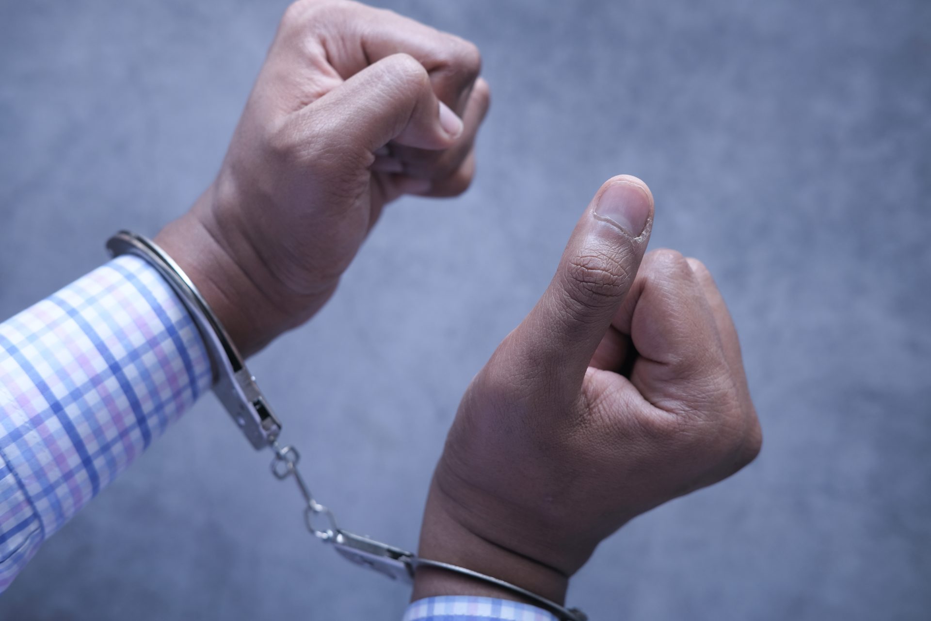 hands of a man with handcuffs close up 2023 11 27 04 54 50 utc