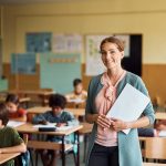 happy elementary school teacher in the classroom l 2023 11 27 05 15 02 utc
