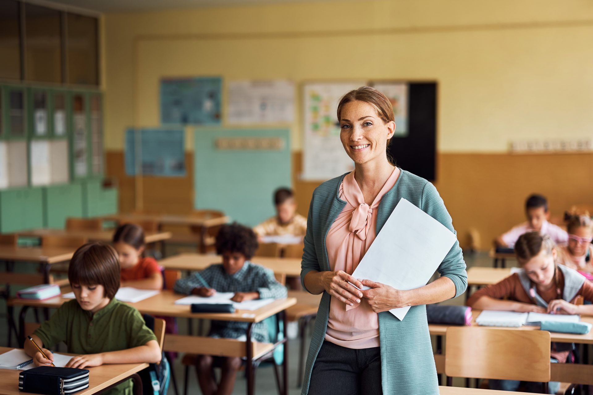 happy elementary school teacher in the classroom l 2023 11 27 05 15 02 utc
