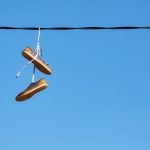 pair of old shoes hang on power line 2023 11 27 05 13 19 utc