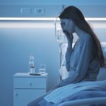 sad sleepless patient sitting on the hospital bed 2023 11 27 05 13 06 utc