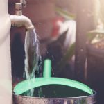 water from a tap filling a watering can 2023 11 27 05 06 21 utc