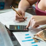 woman reviewing her business statistics chart bal 2023 12 18 19 16 20 utc