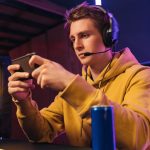young pro gamer playing in online mobile video gam 2023 11 27 04 57 57 utc