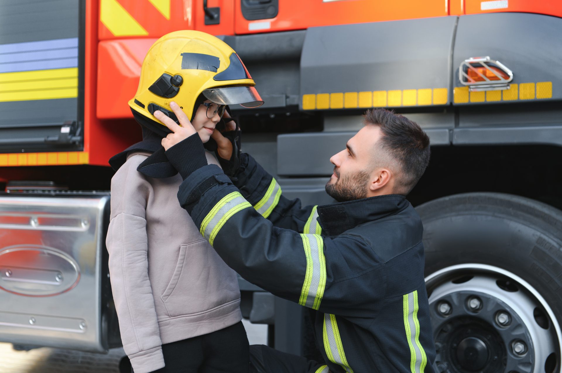 a fireman shows his work to his young son a boy i 2023 11 27 05 16 06 utc