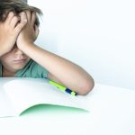 crying schoolboy doing homework at home writes in 2023 11 27 05 11 56 utc